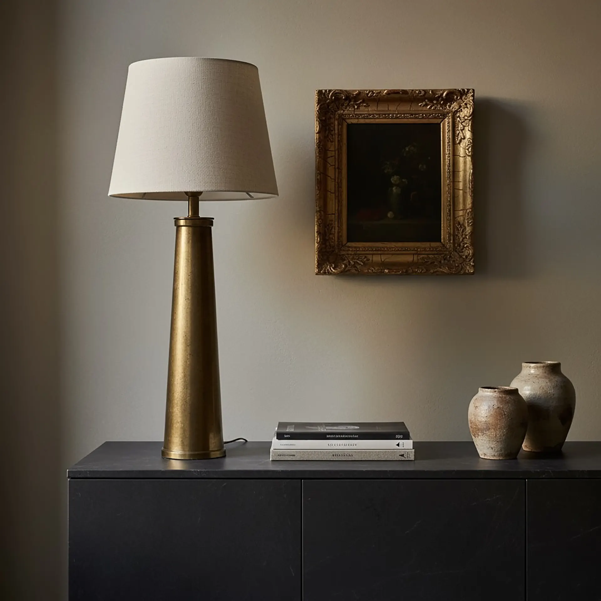 Modern minimalist interior featuring vintage 19th-century chandelier above contemporary sleek dining table creating era-blending design