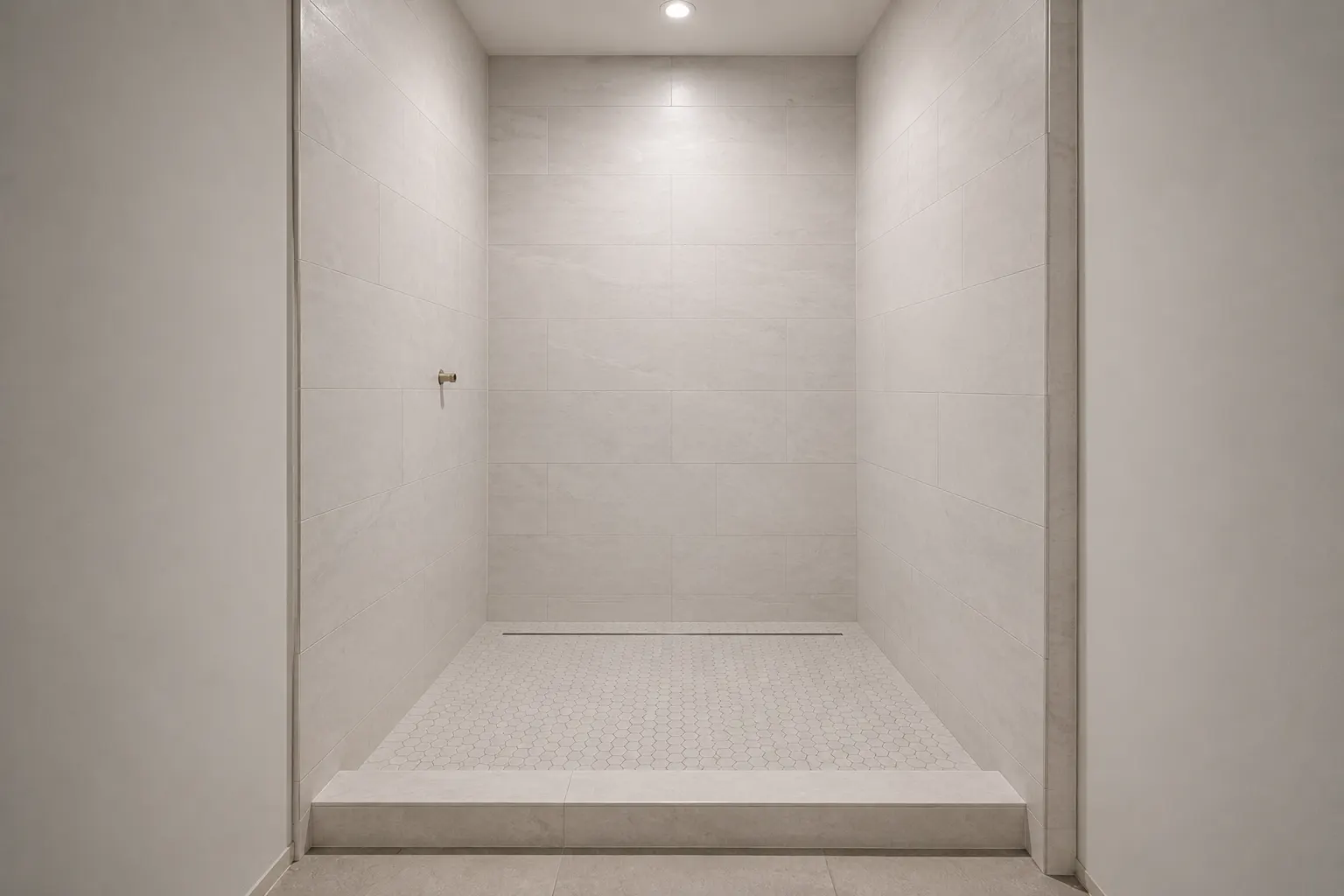 Tile goes on before the fixtures, which is why the finish height gets settled while the wall is still open